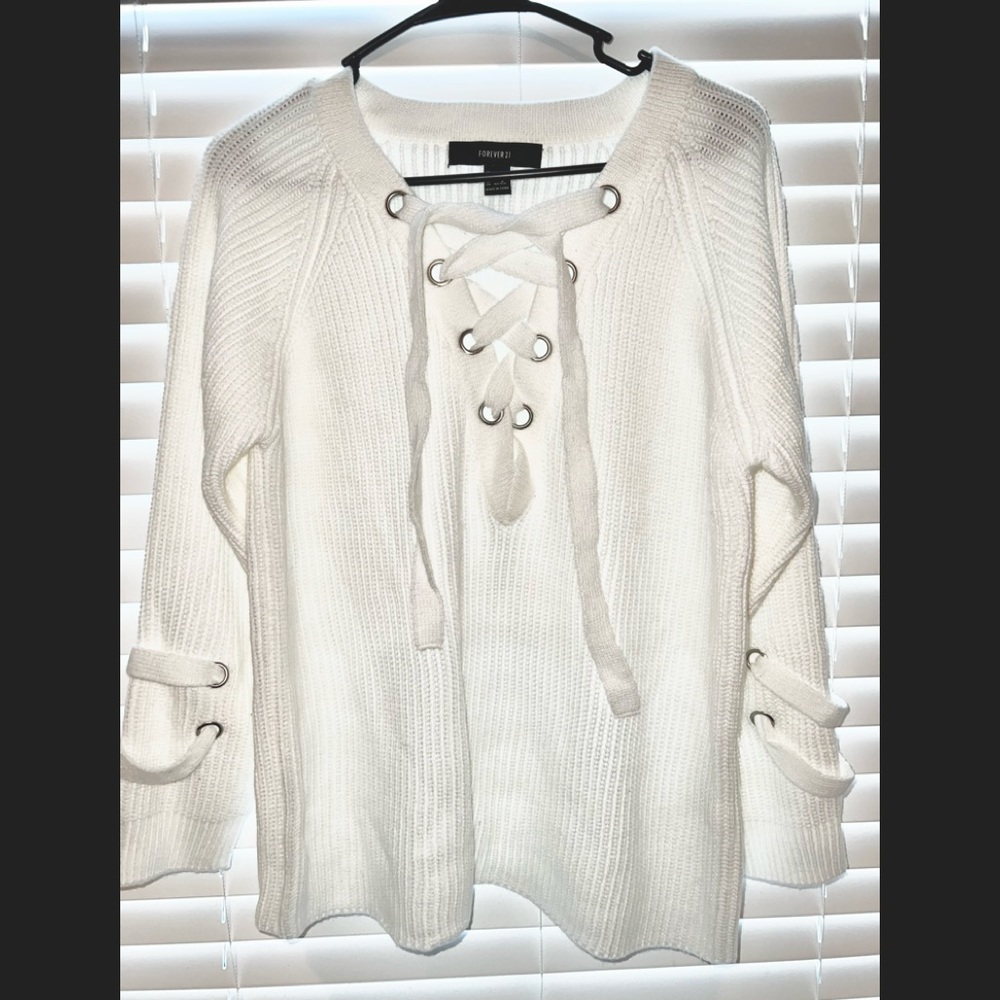 Brand new white sweater, cross tie in the front, unique details on the sleeves.